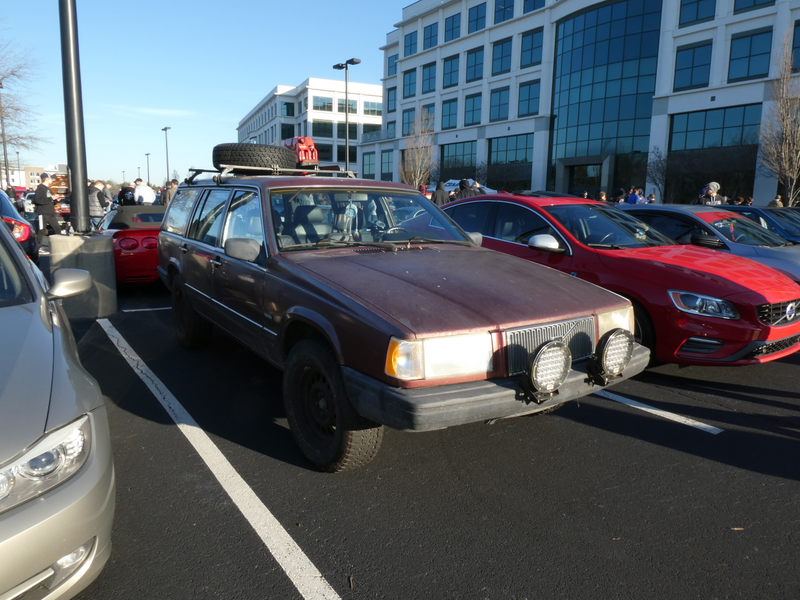 Lifted Volvo next to a contemporary family member